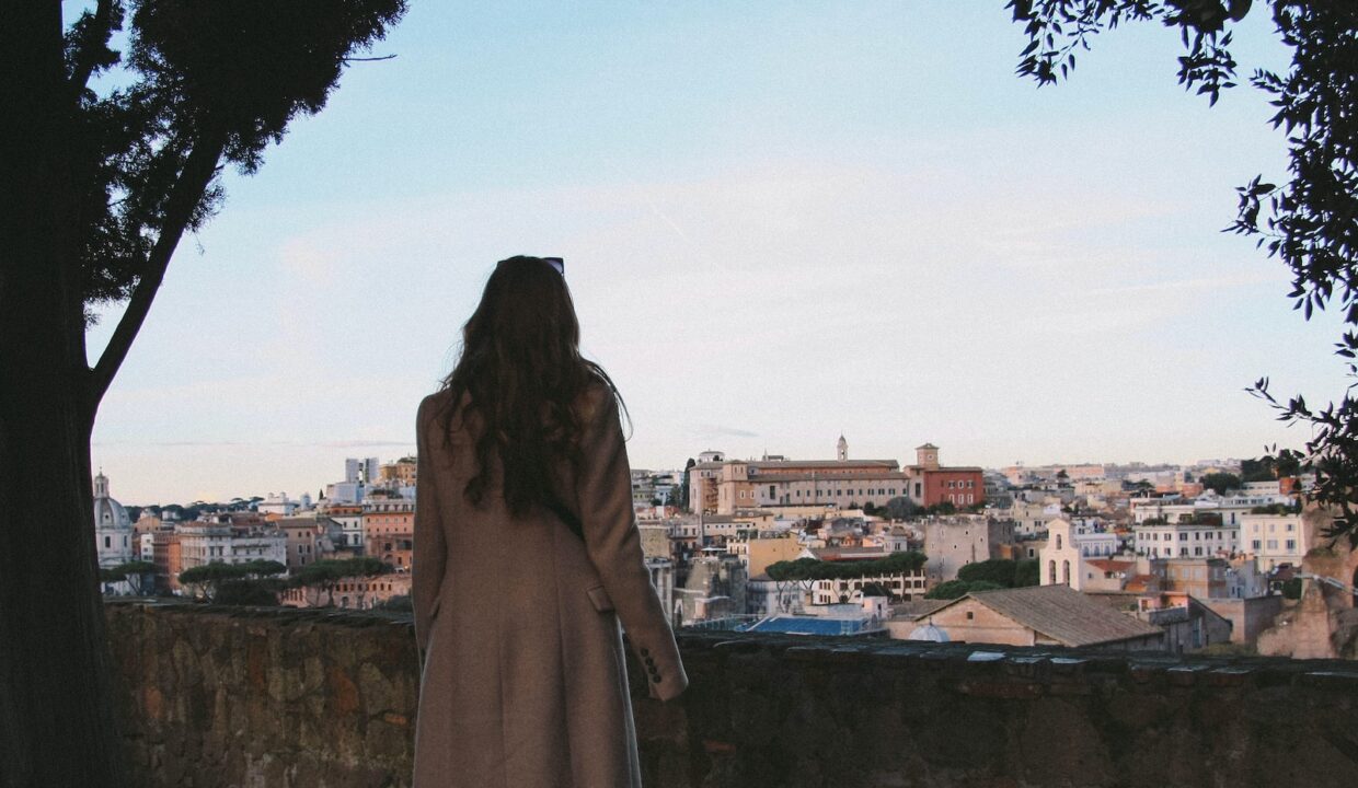 woman wearing brown coat